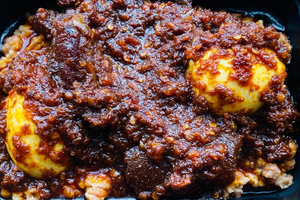 Ewa Aganyi with sauce
